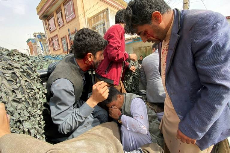 Bomb attack kills guard, wounds journalists in Afghan north