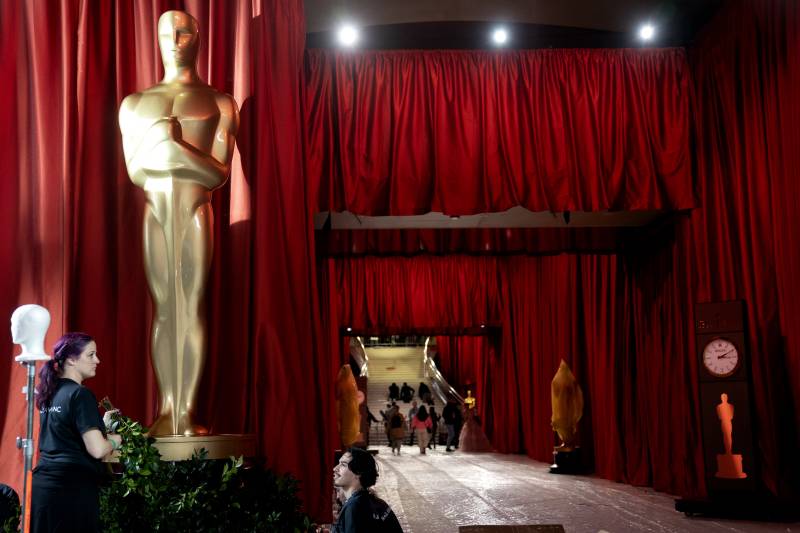 Final preparations are made along the red carpet arrival area for the 95th Academy Awards, in Hollywood, Los Angeles, California, on March 11, 2023. AFP