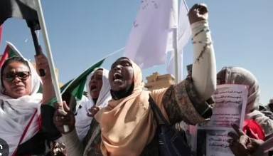 Sudan coup leader urges troops to back democratic transition