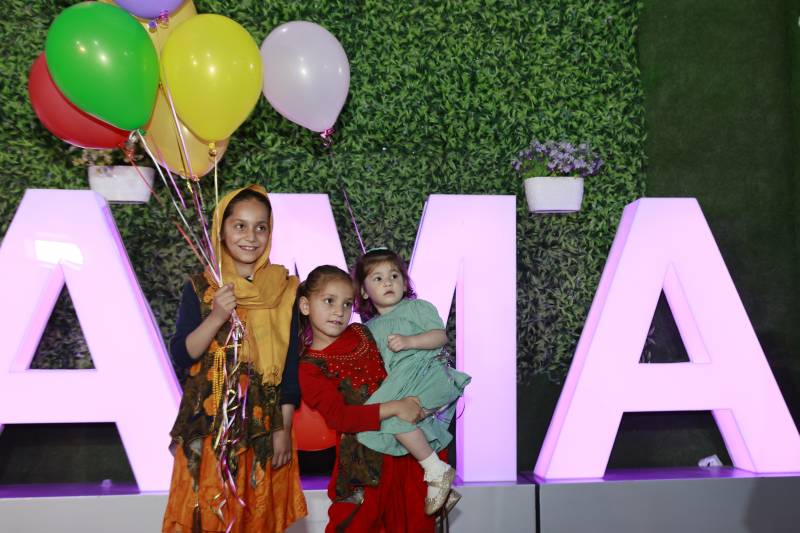 Afghan toddler Maryam, who was bundled onto an evacuation flight after her parents were killed in a huge bomb blast at Kabul airport in 2021, reunites with her sisters at an orphanage in Doha. AFP