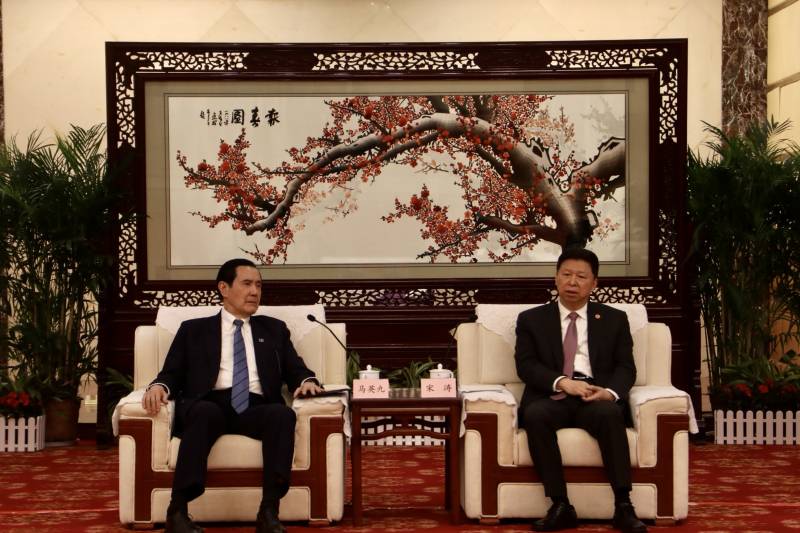 Former Taiwanese president Ma Ying-jeou (L) speaking with China’s Taiwan Affairs Office Director Dong Tao in Wuhan. AFP