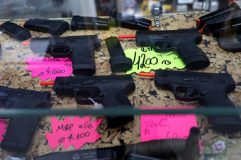 Handguns are displayed for sale in a shop in the Givat Zeev settlement in the West Bank. AFP