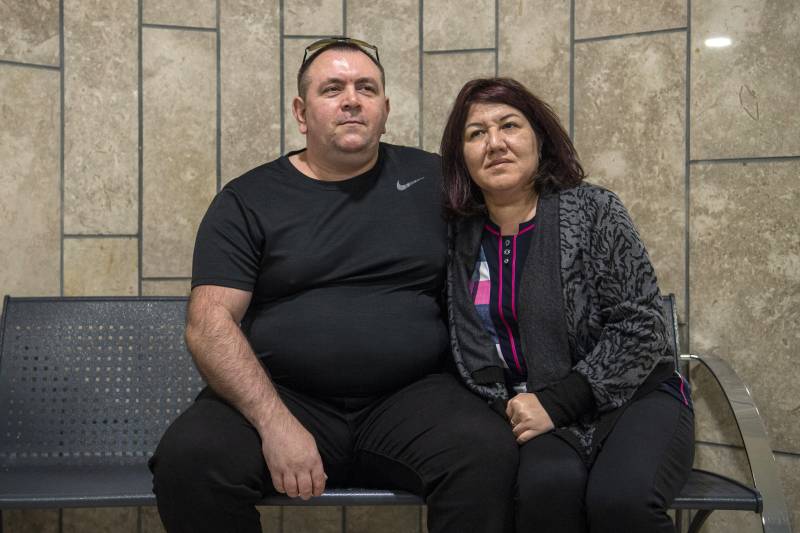 Roman Zdorov (L) and his wife Olga sit at the District Court in Nazareth. AFP