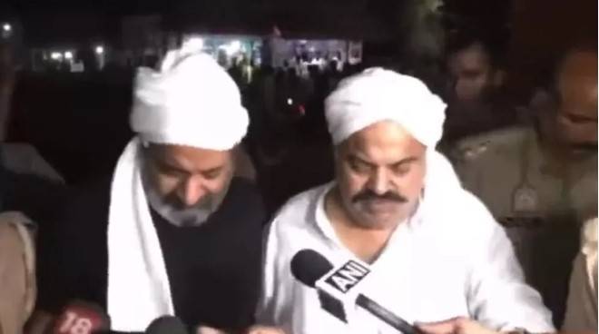 Atiq Ahmed (right) and his brother Ashraf taking questions from journalists moments before they were shot dead live on TV. 