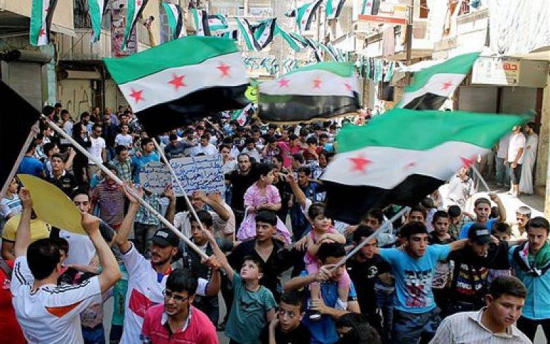 Syrians protest Arab detente with Assad