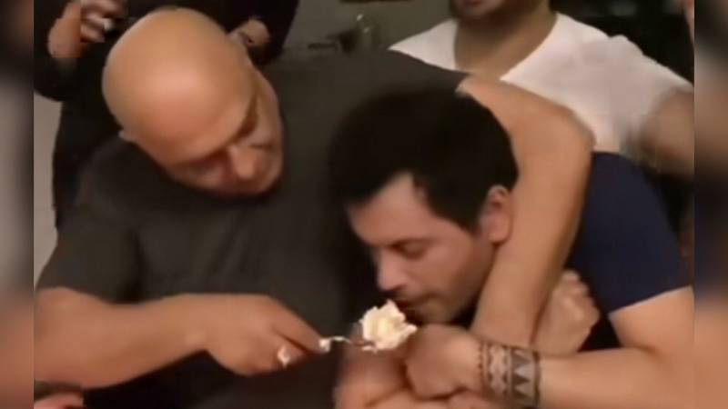 Fans furious after Ali Azmat shoves big chunk of cake in his pal’s mouth