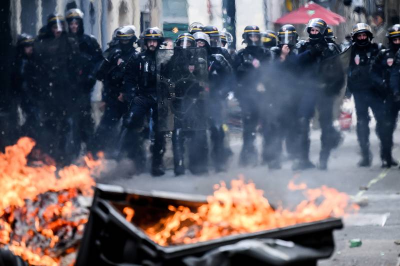 More than 100 police injured in clashes at May Day protests against Macron