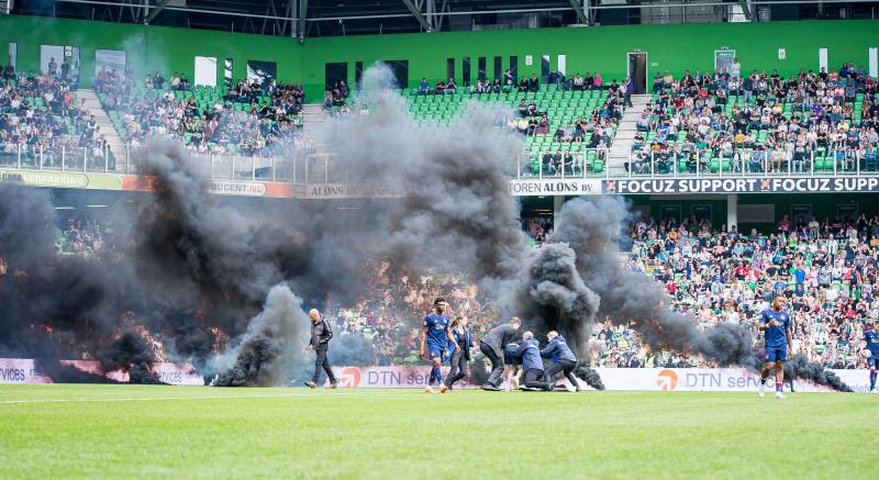 Dutch game abandoned after nine minutes as smoke bombs thrown