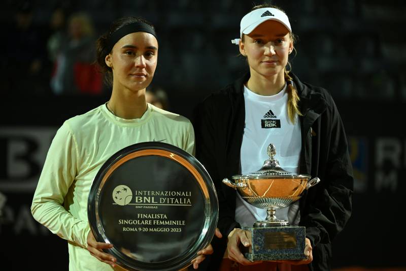 Ukraine's Anhelina Kalinina (L) and Kazakhstan's Elena Rybakina pose with trophies after Kalinina forfeited due to injury during the final match of the Women's WTA Rome Open tennis tournament against Kazakhstan's Elena Rybakina at Foro Italico in Rome on May 20, 2023. Rybakina wins the Rome WTA at the start of the second set of the finals. AFP