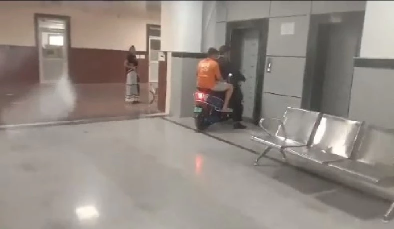 Man uses motorbike to rush injured son to third hospital floor