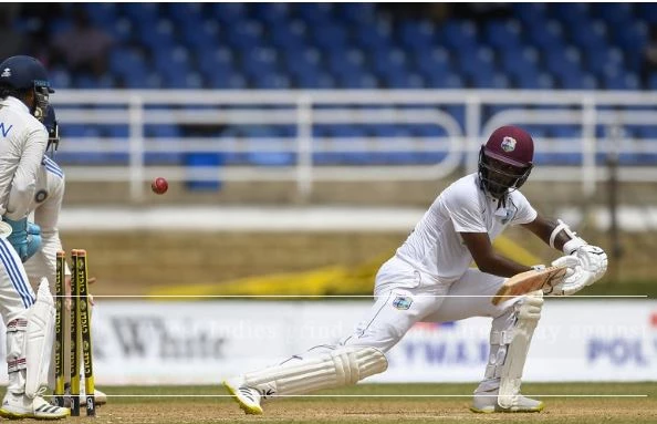 West Indies grind through turgid day against India