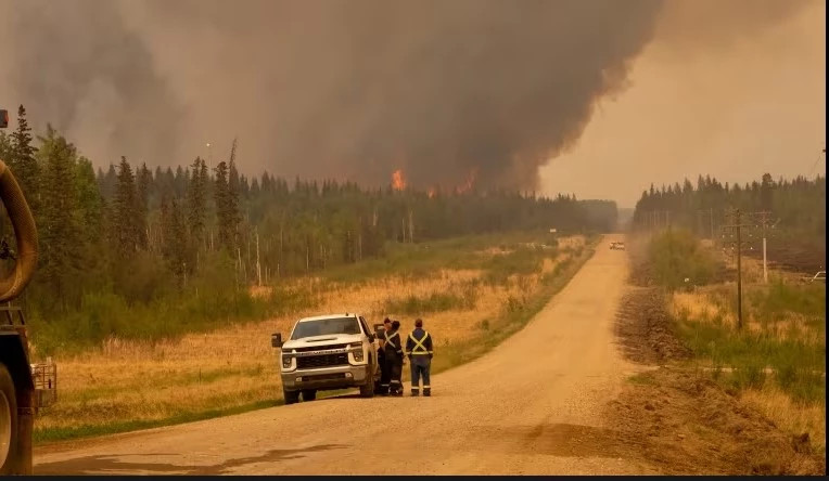 Thousands flee wildfires in Canada's far north