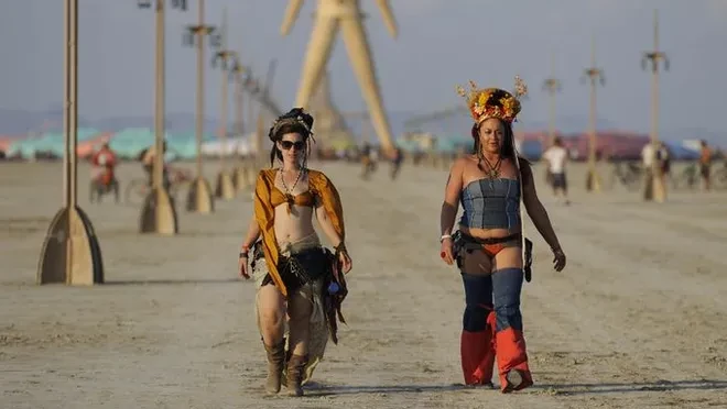 Thousands stuck in mud at Burning Man festival, one dead