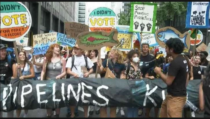 Climate protesters throng New York, demand end to fossil fuels