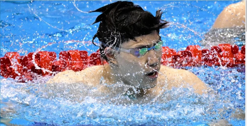 Breaststroke king Qin fires Asian Games warning