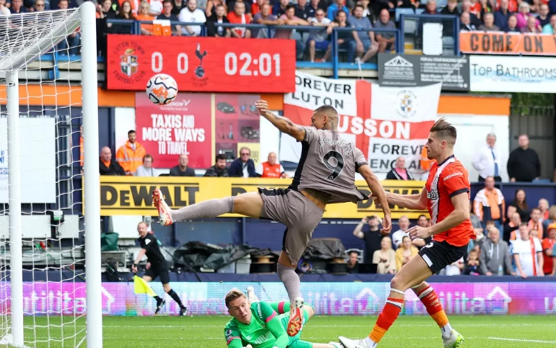 Ten-man Spurs top Premier League as Van de Ven sinks Luton