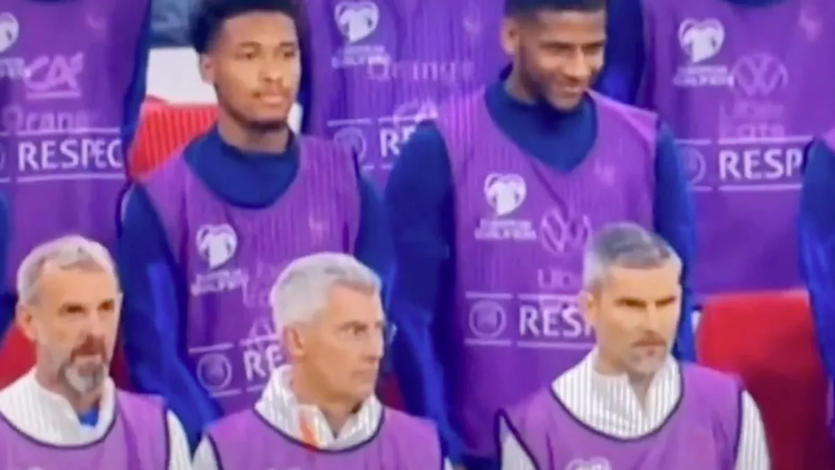 French footballer asked to explain laugh during minute's silence