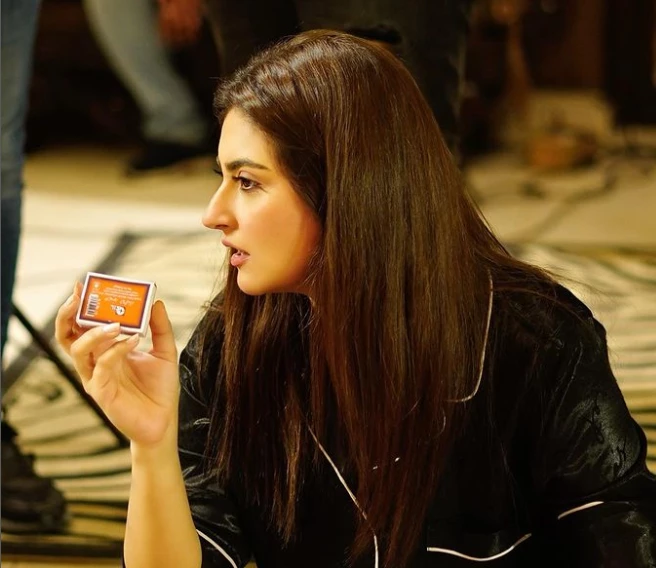 Eyebrows raised as Hiba Bukhari holds matchbox in hand