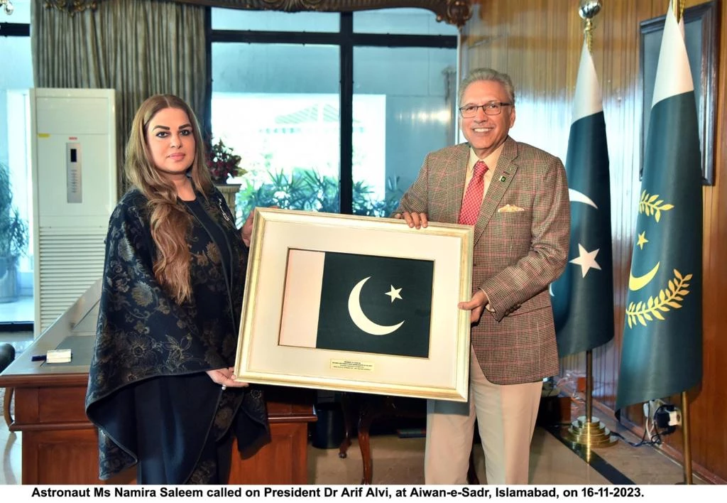 Namira Salim presents Dr Alvi National Flag she flew to space