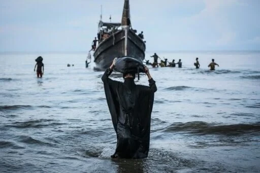 Indonesia moves rejected Rohingya refugees stranded on beach