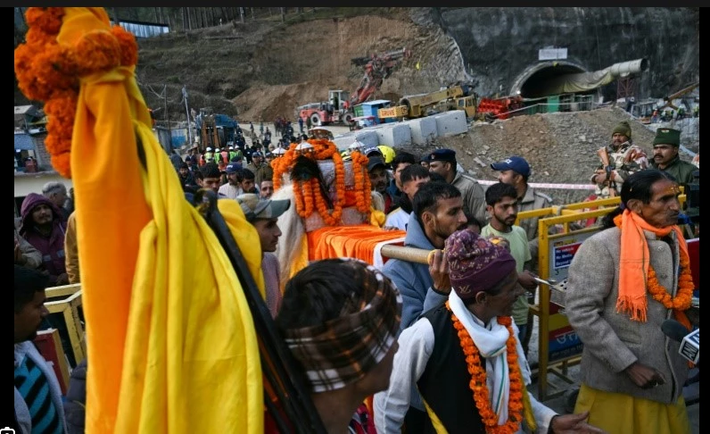 Tearful families pray for Indian workers trapped in tunnel