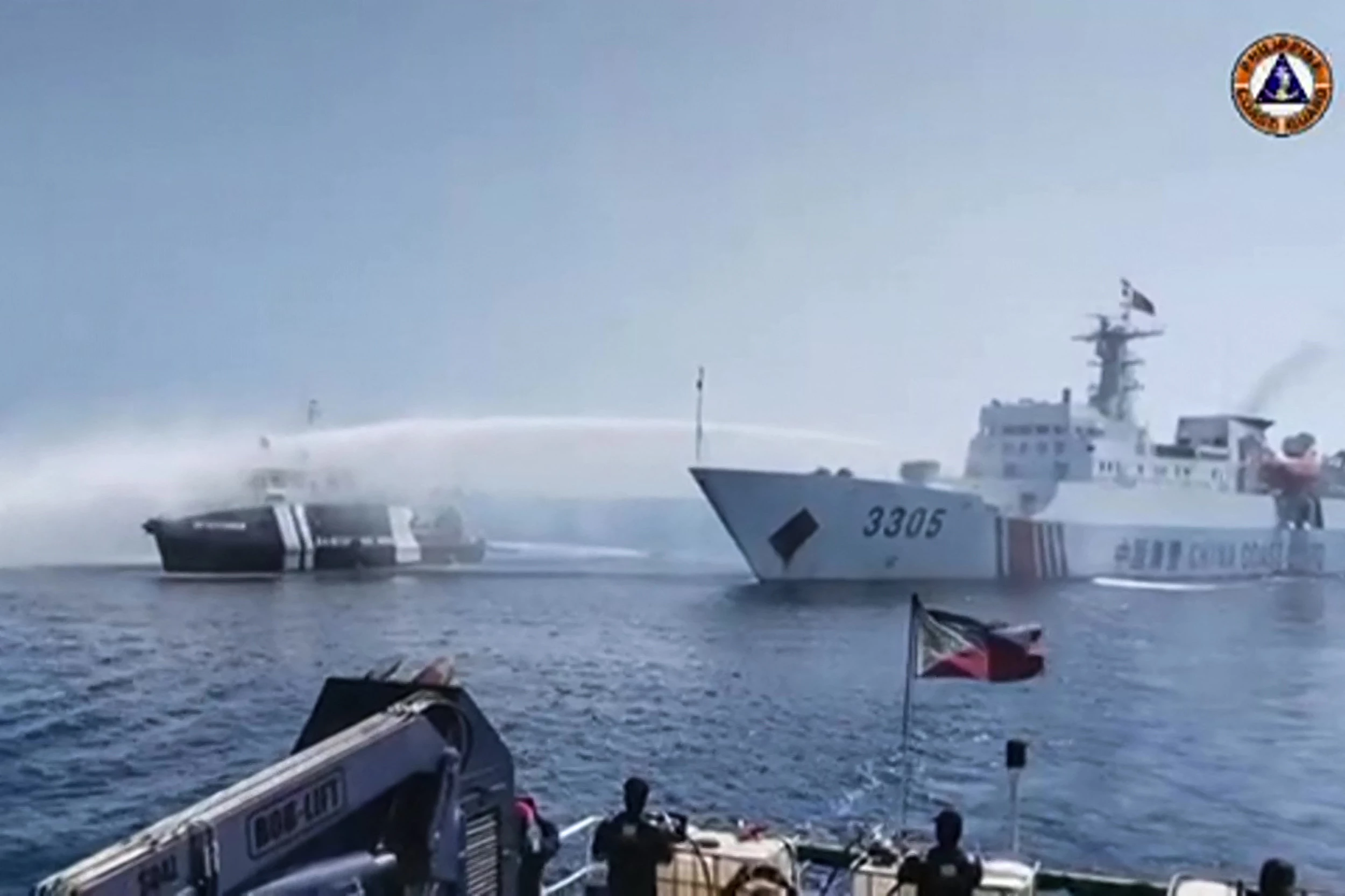 Philippines accuses Chinese coast guard of shooting water cannon at its boats