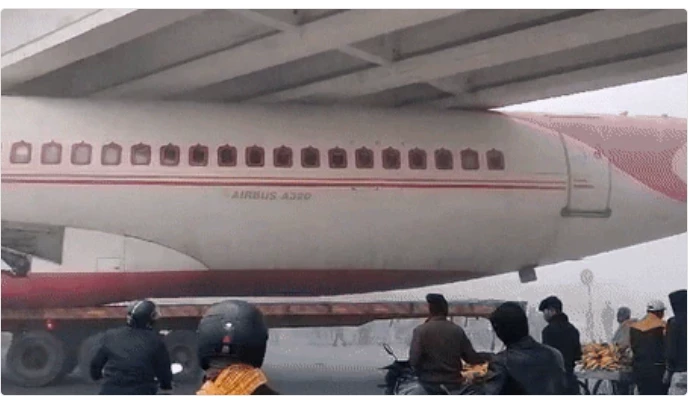 India plane gets stuck under the bridge