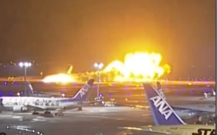 Airliner on fire on runway at Tokyo's Haneda airport