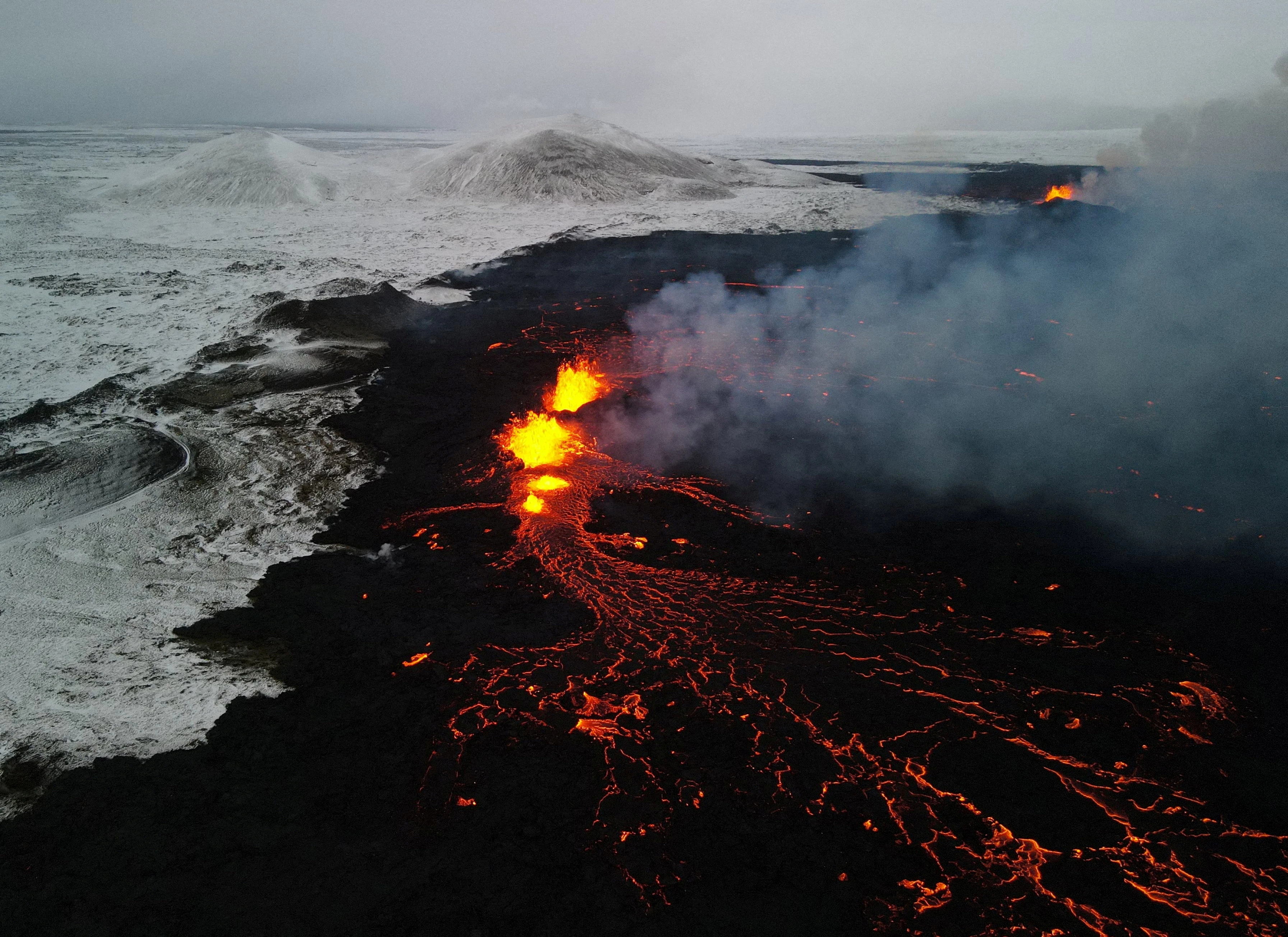 Houses burn as new volcanic eruption threatens Icelandic village