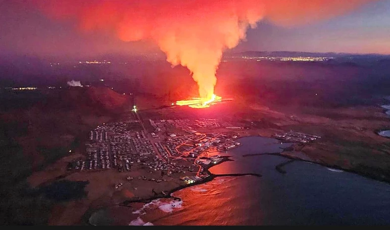 Volcano lava flows into Icelandic village, engulfing homes