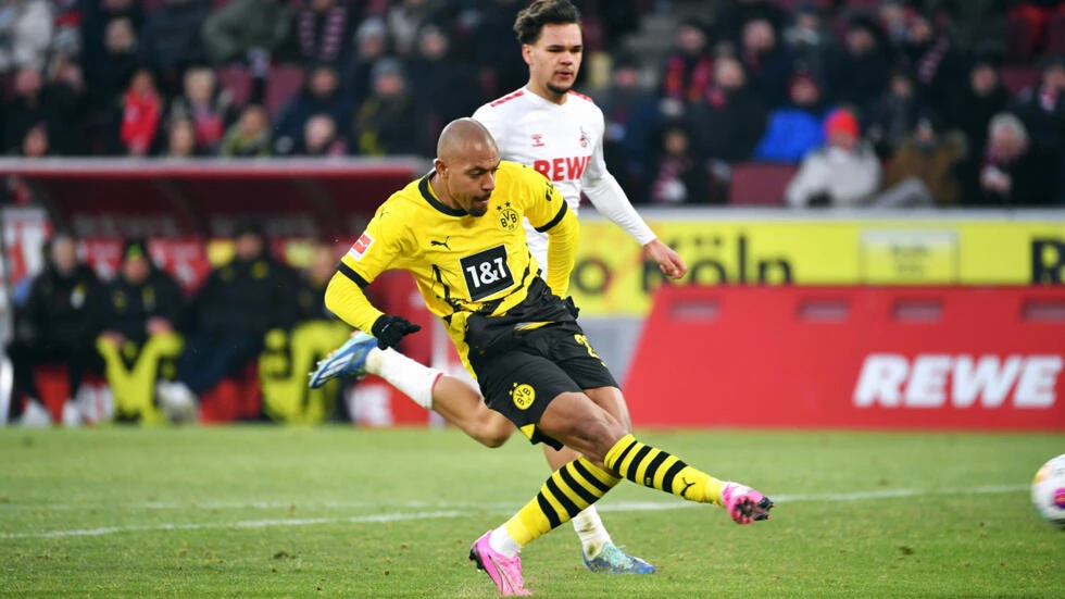 Malen scores brace as Dortmund beat Cologne despite chocolate coin protest