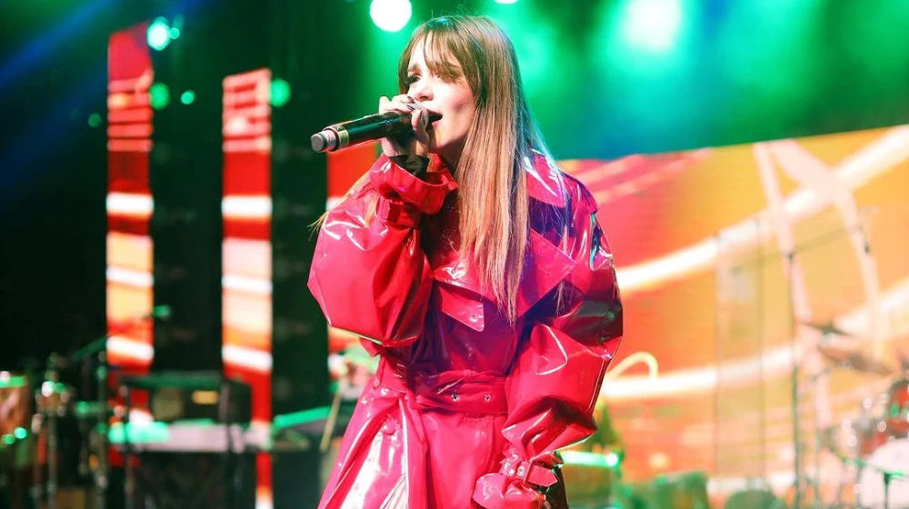 Aima Baig rocks Dubai wearing red latex trench coat at concert