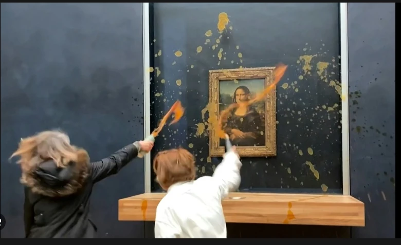 Activists splash soup on glass-protected Mona Lisa