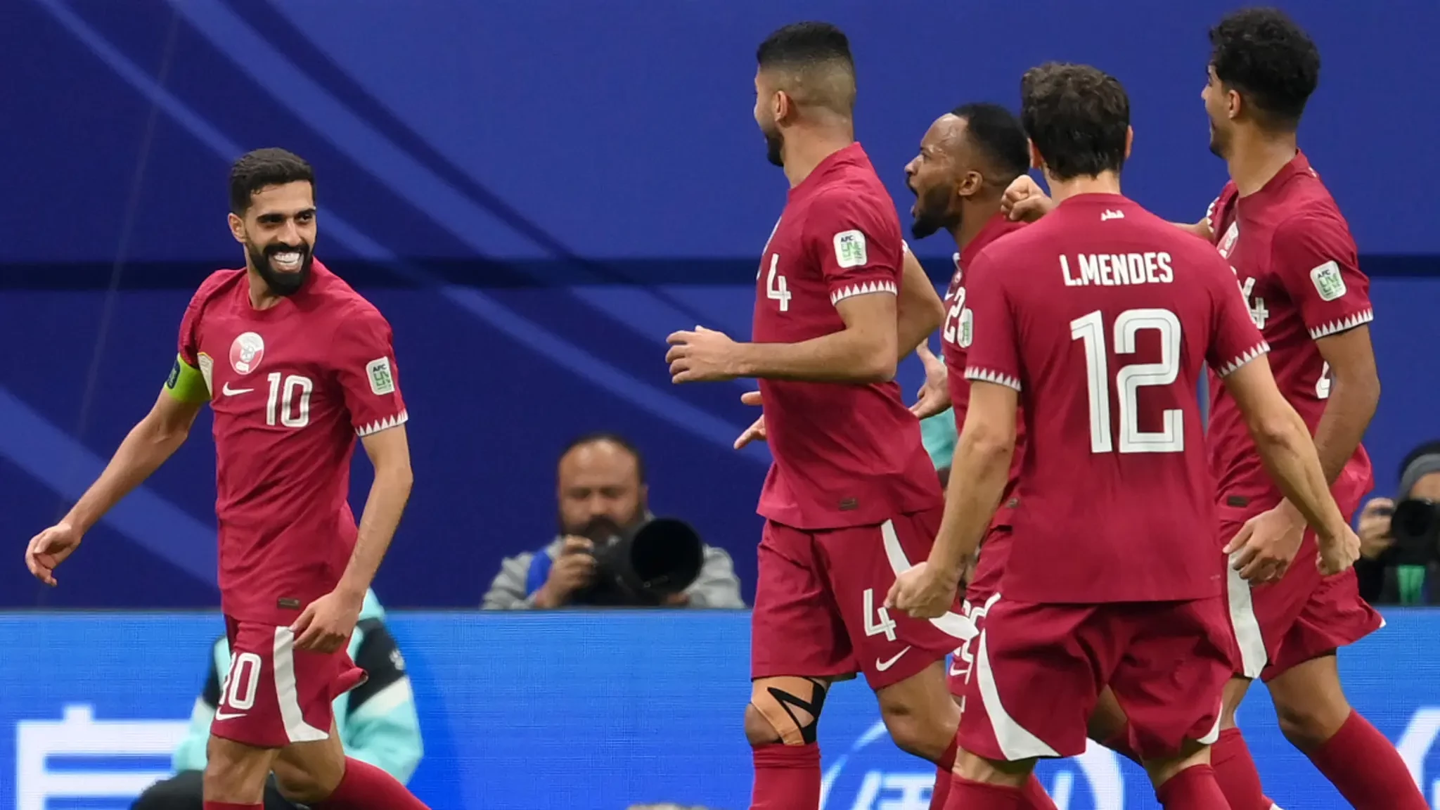 Qatar beat Uzbekistan on penalties to reach Asian Cup semis