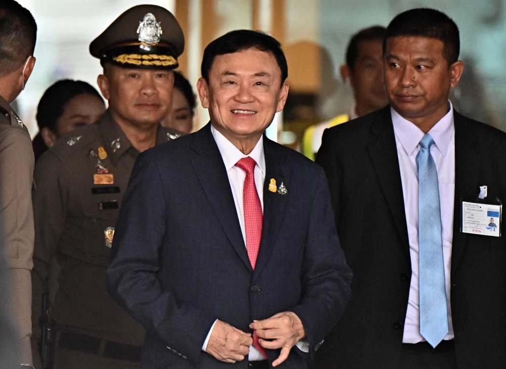 Thai ex-PM Thaksin returns home after release on parole