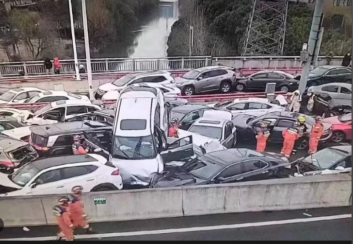 Hundred-car collision on icy China road causes nine injuries