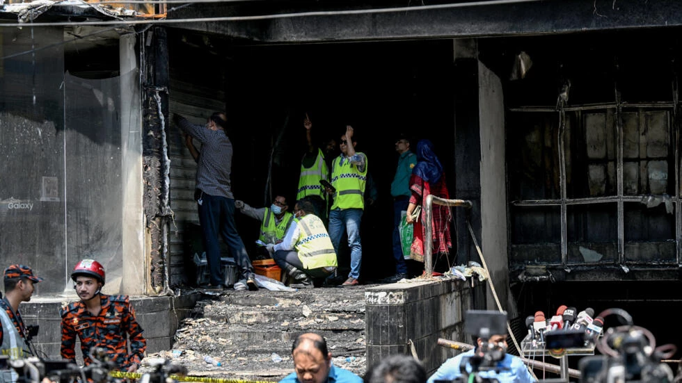 Grieving families await bodies after Bangladesh fire