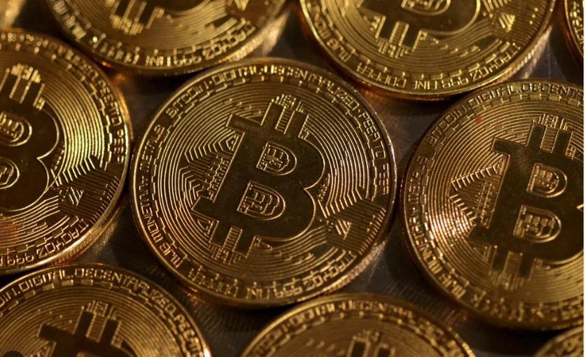 Gold, bitcoin hit records but stock markets fall