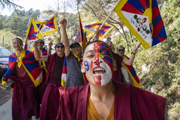 Exiled Tibetans march on anniversary of crushed uprising