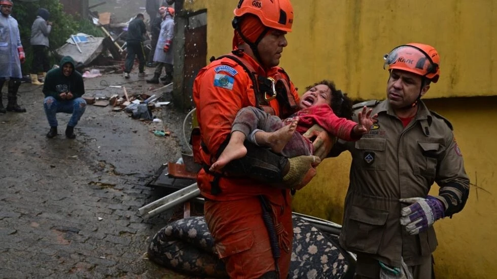 Rescuers race to find trapped people as Brazil storms kill at least 20