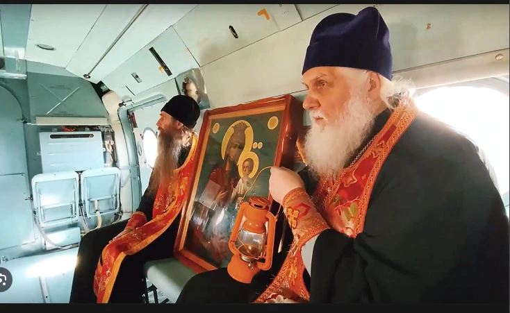 Flying Russian priests pray for floods to end