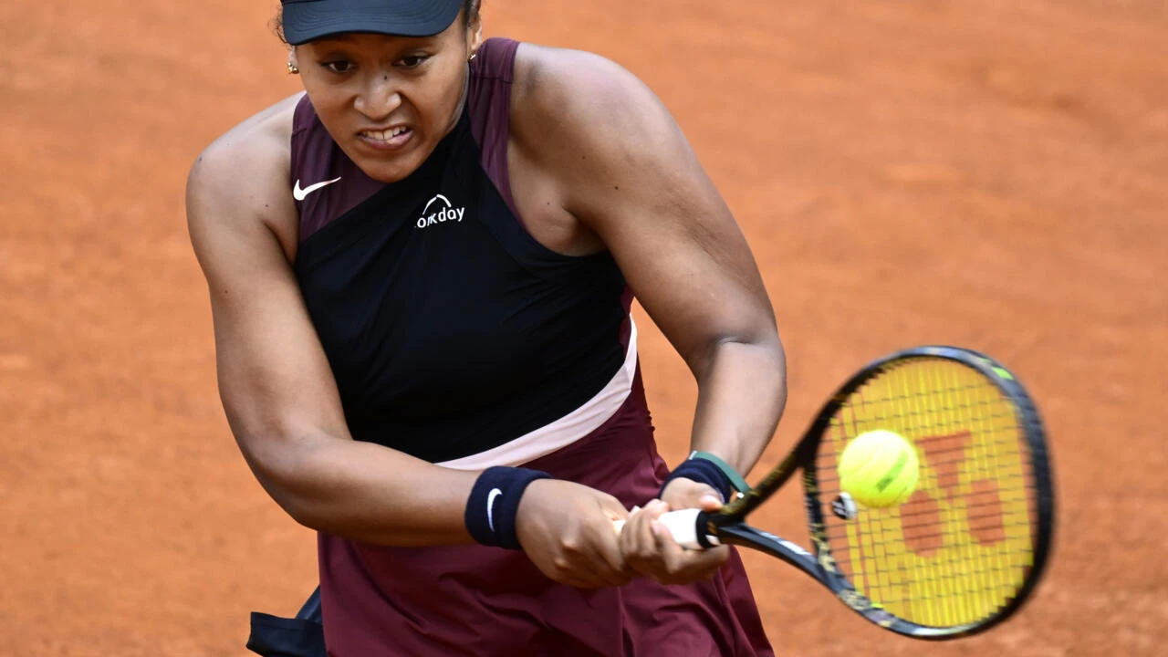 Osaka wins in Rome after three-year absence