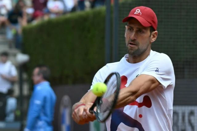 'Fine' Djokovic dons cycling crash helmet after Rome bottle drama