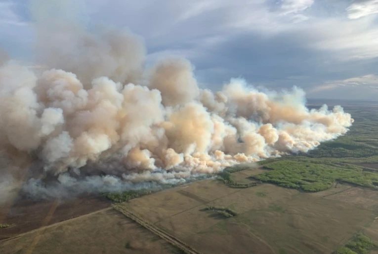 Early forest fires prompt evacuations in Canada