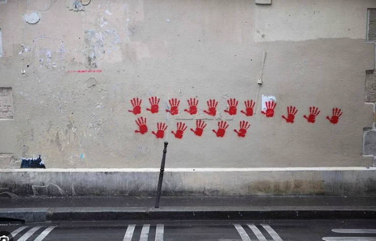 Paris Holocaust memorial hit with red hand graffiti