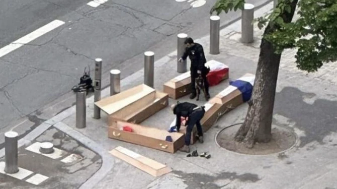 France arrests three after coffins left at Eiffel Tower