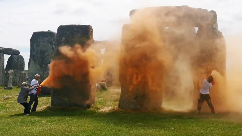 UK police arrest pair after Stonehenge sprayed with orange substance