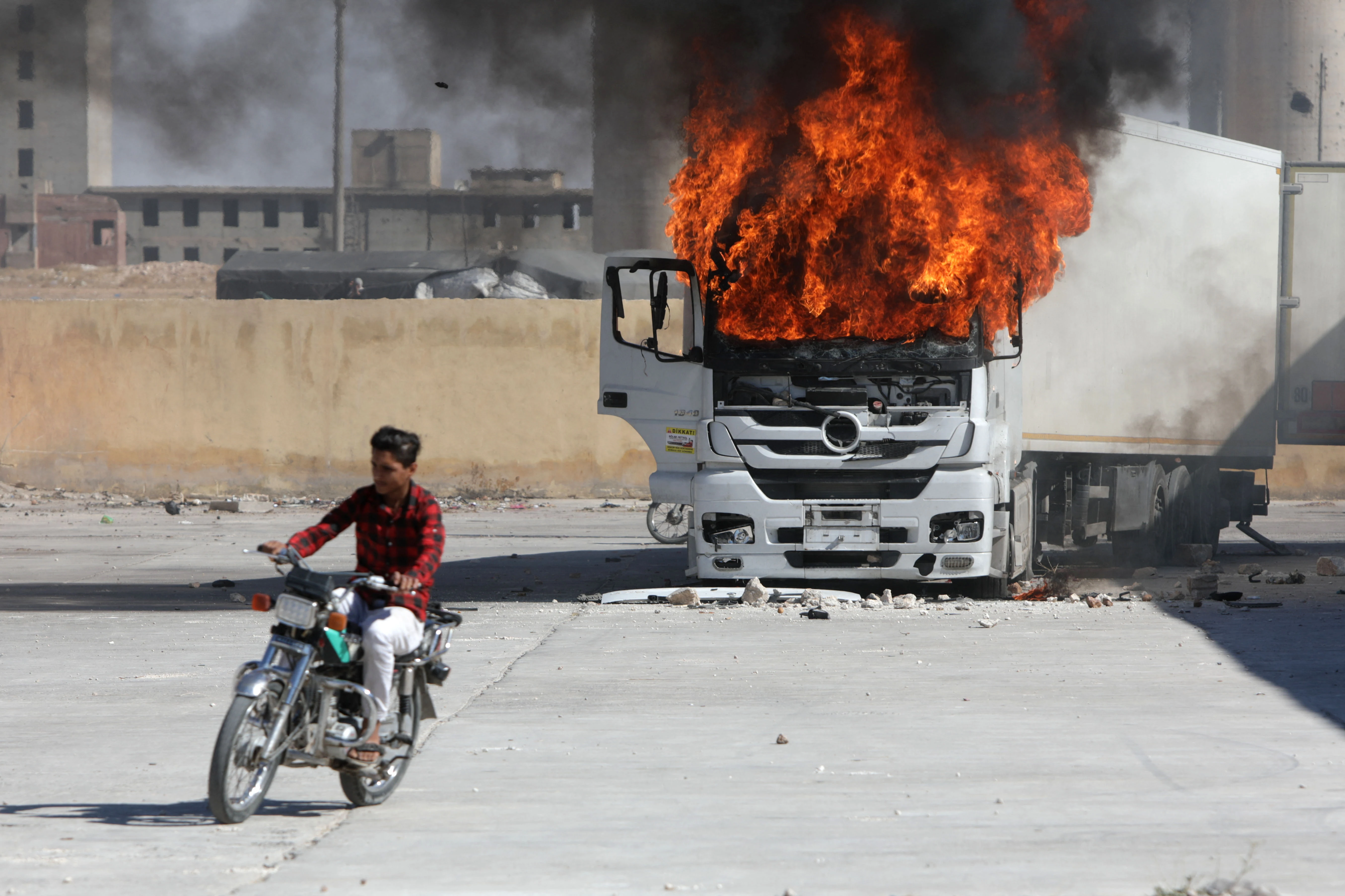 Four dead as armed protesters, Turkish forces clash in north Syria: monitor