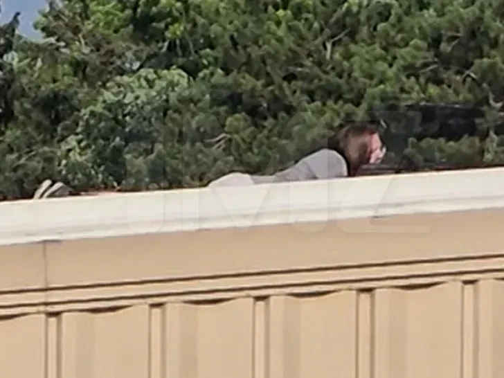 Alleged Trump shooter filmed on roof with rifle