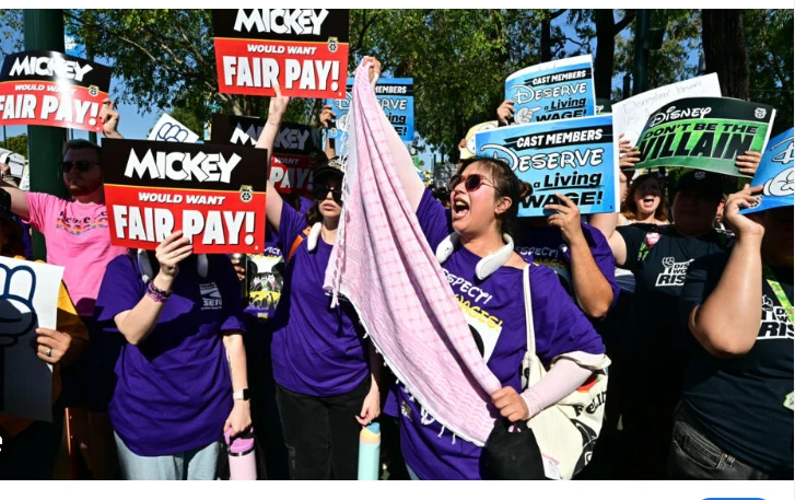 Disneyland workers threaten strike action over wages, treatment